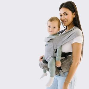 Tushbaby snug infant attachment. Hip seat hands free attachment.